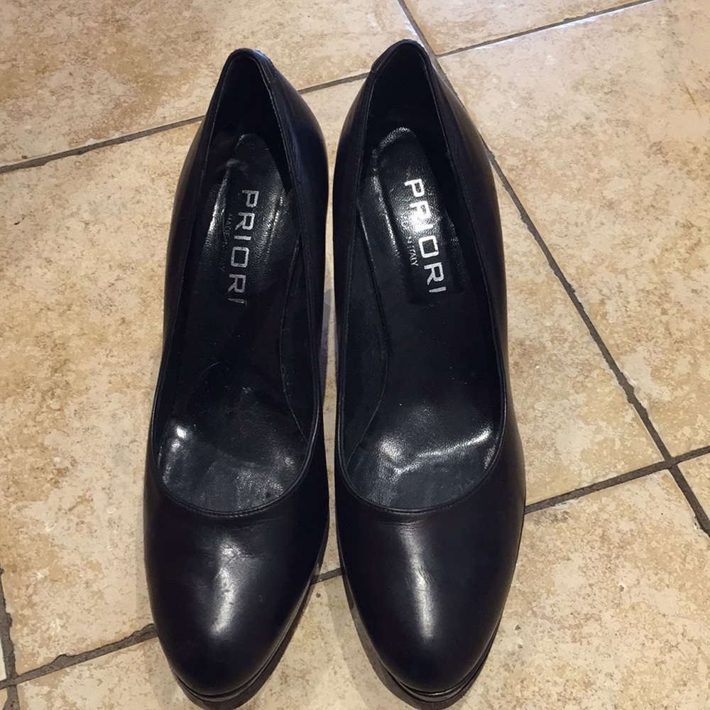 Black leather pumps